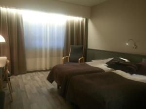 Hotelli Kivitippu客房内的一张或多张床位