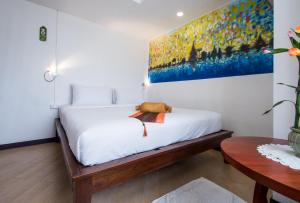 Chedi Home -SHA Extra Plus客房内的一张或多张床位