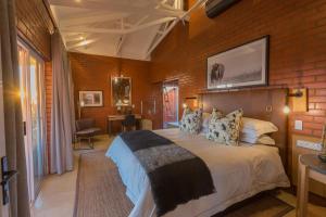 Rockfig Lodge Madikwe客房内的一张或多张床位