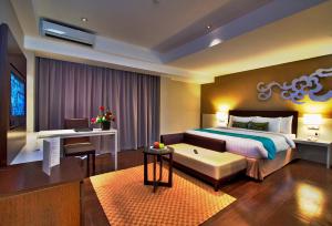 阿斯顿瑟尔滨海酒店及会议中心 - 邦加客房内的一张或多张床位