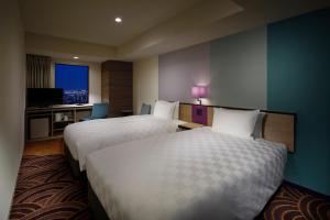 池袋阳光城王子酒店客房内的一张或多张床位