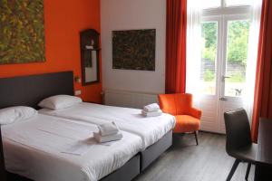Hotel Oranjeoord客房内的一张或多张床位