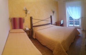 Hotel La Baita客房内的一张或多张床位