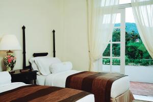 Cameron Highlands Resort - Small Luxury Hotels of the World客房内的一张或多张床位