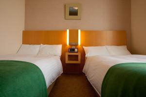 北野广场六甲庄酒店客房内的一张或多张床位