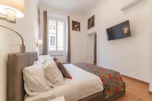 Appartamento Via Genova客房内的一张或多张床位