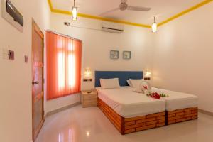 Dream Inn Sun Beach Hotel Maldives客房内的一张或多张床位