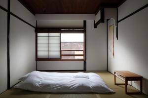 京町家旅宿 大雲客房内的一张或多张床位
