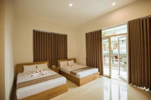 Tuyet Suong Villa Hotel客房内的一张或多张床位