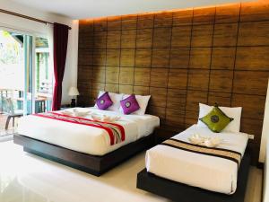 维帕热带度假酒店客房内的一张或多张床位