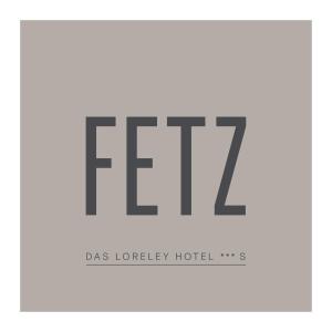 DörscheidFETZ DAS LORELEY HOTEL的带有faq字的酒店的标志