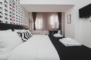 Hotel Marienplatz Podgorica客房内的一张或多张床位