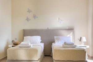 伊萨洛斯别墅度假屋客房内的一张或多张床位