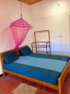 Sai Seashell Rest Inn Nilaveli客房内的一张或多张床位
