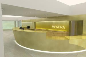 特罗吉尔Hotel Medena Budget的大堂的米 ⁇ 娜柜台,有黄色标志