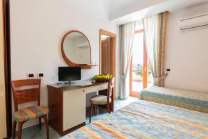 La Capannina - Hotel & Apartments客房内的一张或多张床位