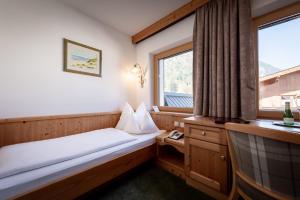 Hotel Alpenrose客房内的一张或多张床位