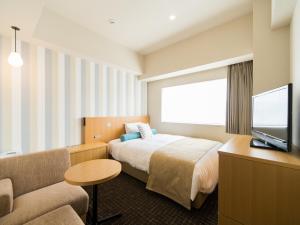 广岛华盛顿酒店客房内的一张或多张床位
