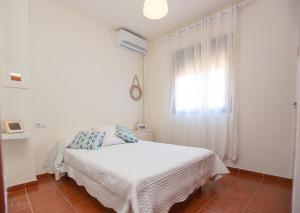 Apartamento Centro Sanlucar - Playa客房内的一张或多张床位