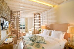 佩蒂诺斯海滩酒店客房内的一张或多张床位