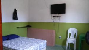 Pousada Recanto Atalaia客房内的一张或多张床位