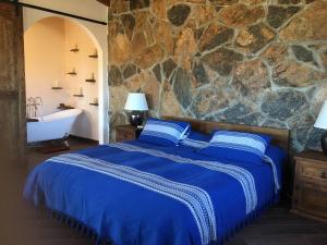 En'kanto Valle de Guadalupe客房内的一张或多张床位