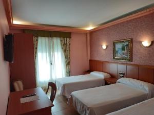 Hotel Real de Castilla客房内的一张或多张床位