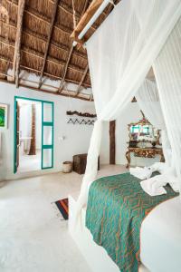 Hotel Cormoran Tulum & Cenote客房内的一张或多张床位