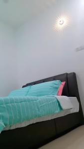 Home2u Alor Setar Homestay客房内的一张或多张床位