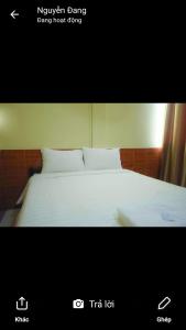 万象英塔齐旅馆的一张酒店客房的床照片