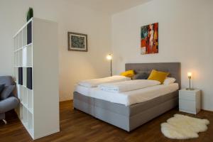 Albergo Diffuso ELA Living - Design Apartment & Room客房内的一张或多张床位