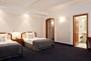 Gildors Hotel Atmosphère客房内的一张或多张床位