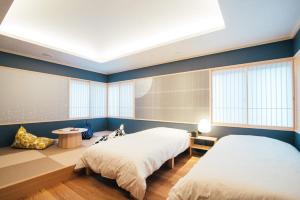 Ishizue TABI-NE客房内的一张或多张床位