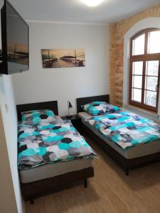 Noclegi Stara Wozownia客房内的一张或多张床位