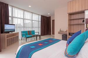 查姆帕中央酒店客房内的一张或多张床位