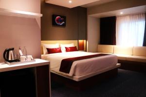 Star Hotel Chiang Mai - SHA Extra Pus客房内的一张或多张床位