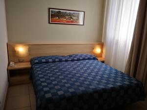 多姆斯西利欧塔酒店客房内的一张或多张床位