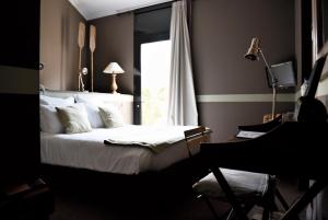 巴尔迪库里尔酒店客房内的一张或多张床位