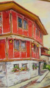 科普里夫什迪察Guest House Maria的窗户上一幅红色房子的画