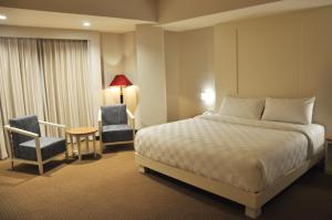 Beverly Hotel Batam客房内的一张或多张床位