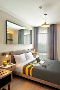 Rooms Inc Semarang客房内的一张或多张床位