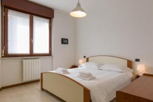 Appartamento Verona Fiera e Centro客房内的一张或多张床位