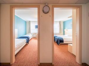 Rija Bauska Hotel客房内的一张或多张床位