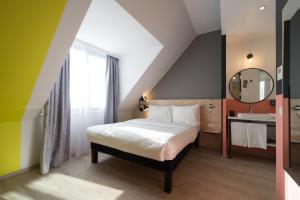 ibis Styles Wien Messe Prater客房内的一张或多张床位