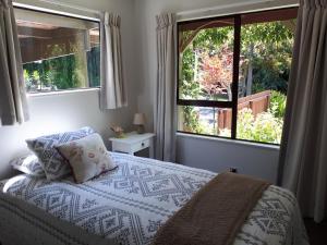 Rangaroa Heights客房内的一张或多张床位