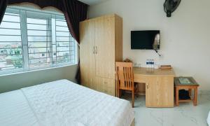 Hoang Ngan 2 Hotel - TP. Vinh客房内的一张或多张床位