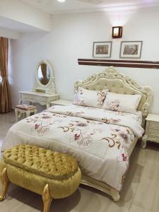 巴生武吉丁宜舒适之家旅馆客房内的一张或多张床位