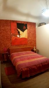 莫尔费塔La chiè的一间卧室配有一张壁画床