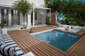 阿吉奥斯普罗科皮奥斯科德罗斯别墅的后院设有游泳池和木甲板
