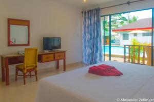 Alona Vida Beach Hill Resort客房内的一张或多张床位
